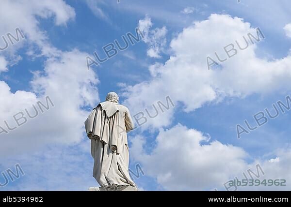 Rear view of the Schiller Monument on Gendarmenmarkt in front of a blue sky with white clouds, Berlin, Germany, Europe.