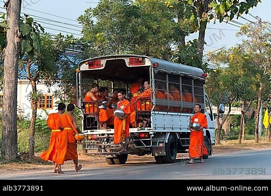 Songthaeo or songthaew, converted vehicle with young Buddhist monks from monastery school, Sukhothai province, Thailand, Asia.