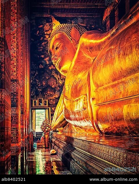 Vintage retro effect filtered hipster style image of reclining Buddha gold statue. Wat Pho, Bangkok, Thailand, Asia.