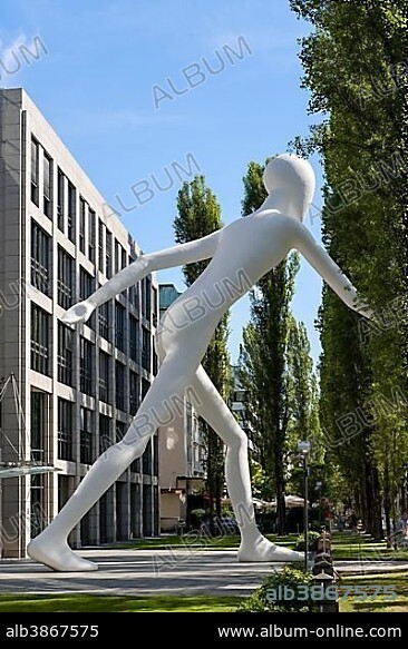 Walking Man sculpture by Jonathan Borofsky in front of insurance company Munich Re, Leopoldstrasse, Schwabing, Munich, Upper Bavaria, Bavaria, Germany, Europe.