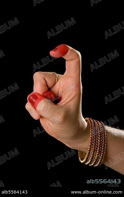 Woman hand showing Tamrachuda hasta (hand gesture) (also called mudra) (meaning "rooster") of indian classic dance Bharata Natyam. Also used in other indian classical dances Kuchipudi and Odissi.