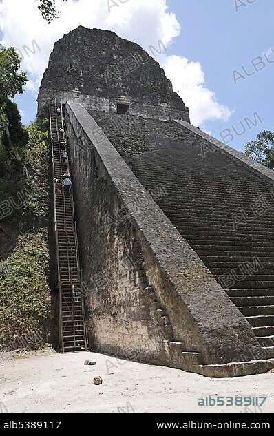 Stone steps and steep wooden steps on Temple 5, Mayan ruins, Tikal, Guatemala, Central America.