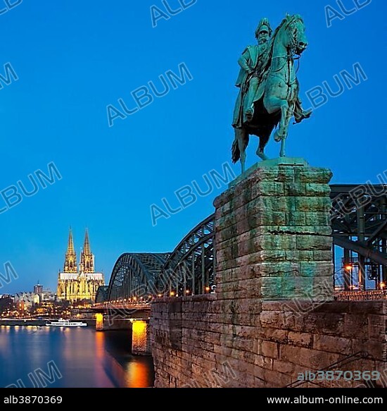 Equestrian statue of Emperor Wilhelm I. with Cologne Cathedral and Hohenzollern Bridge in the blue hour, Cologne, Rhineland, North Rhine-Westphalia, Germany, Europe.
