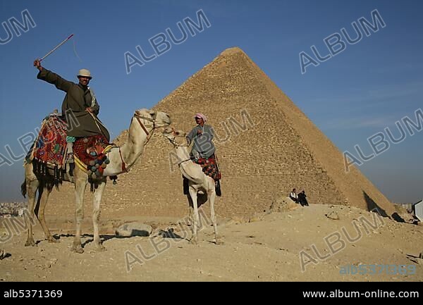 Camel riders in front of pyramid, Giza, Egypt, North Africa, Africa.