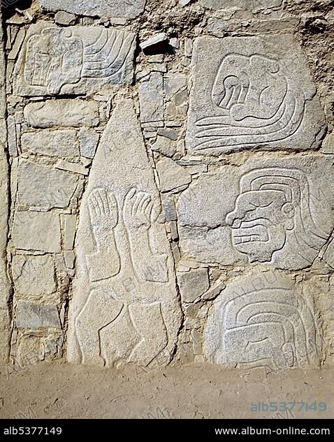 Limbs carved into rock, hieroglyphics on the temple wall of the Pre-Columbian ruins at Sechin, Casma, Peru, South America.
