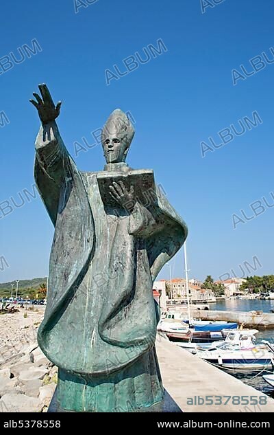 Statue of St Nicholas in the harbour of Sucuraj, island of Hvar, Adriatic Coast, Croatia, Europe.