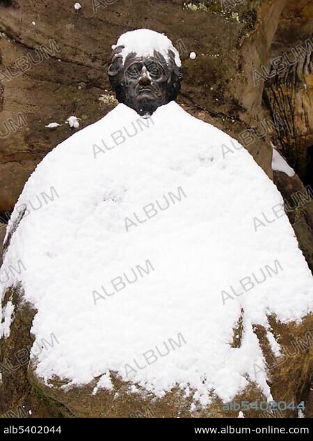 Statue of J. W. Goethe, covered in snow, Adrspach rocks (Adrspasske skaly), Adrspach, Broumovsko protected landscape area, Nachod district, East Bohemia, Czech Republic, Central Europe, Europe.