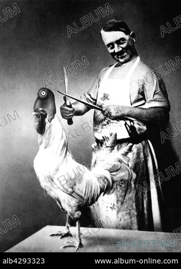 Photomontage by John Heartfield in "Regards" du 7 mai 1936: "Have no fear, he's a vegetarian".. With this words, French minister for Foreign Affairs Mr Laval was trying to reassure Frech civilians (Hitler and the Gallic rooster). 1936. Germany.