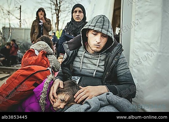 Idomeni refugee camp on the Greece Macedonia border, refugees waiting at a checkpoint, a disabled man with his family, who has been rejected from Macedonia, Idomeni, Central Macedonia, Greece, Europe.