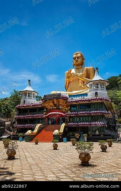 Dambulla, Sri Lanka, September 24, 2009: Golden Buddha temple with gold Buddha on roof, Dambulla, Sri Lanka. Golden Temple of Dambulla is a UNESCO World Heritage Site, Asia.