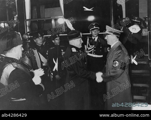 Hitler's official visit in Italy: Benito Mussolini shaking the hand of Adolf Hitler before his departure.. May 10, 1938.