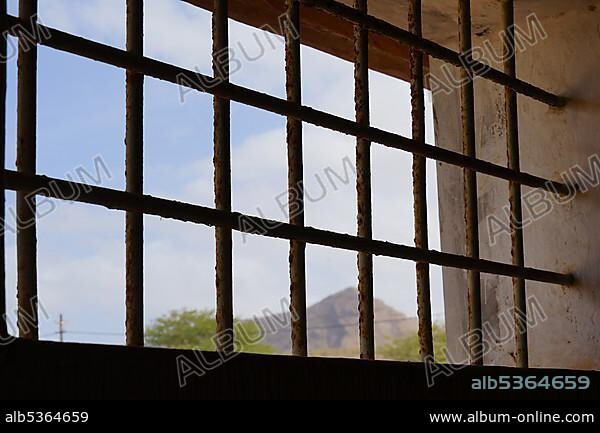 Barred window of a communal cell, bathroom, Tarrafal concentration camp, Santiago Island, Republic of Cape Verde.