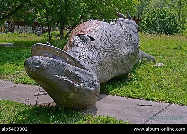 Dinosaur overturned by vandals, abandoned Spreepark Berlin amusement park, formerly known as Kulturpark Plaenterwald in the German Democratic Republic, Germany, Europe.