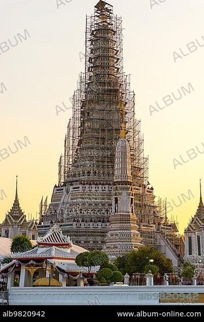 Scaffold around the tower of the buddhist temple Wat Arun in Bangkok. The exterior is by seashell and porcelain and the Thai name is Phra Prang. Wat Arun is among the best known of Thailands landmarks.