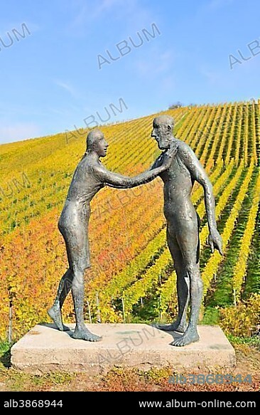 Encounter, bronze sculpture by Karl Ulrich Nuss in front of vineyards in autumn, sculpture path Strümpfelbach, Remstal, Baden-Württemberg, Germany, Europe.