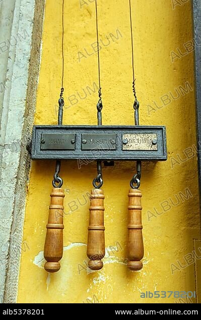 Wood handles for bells at the Mozart Museum, Mozart's Birth House, Getreidegasse, Salzburg, Austria, Europe.