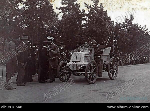 History of the automobile; Fernand Charron; one of the participants (and later winner) of the Paris-Amsterdam race; in his automobile on the road; 1898; France; digitally restored reproduction from a 19th-20th century original; Europe.