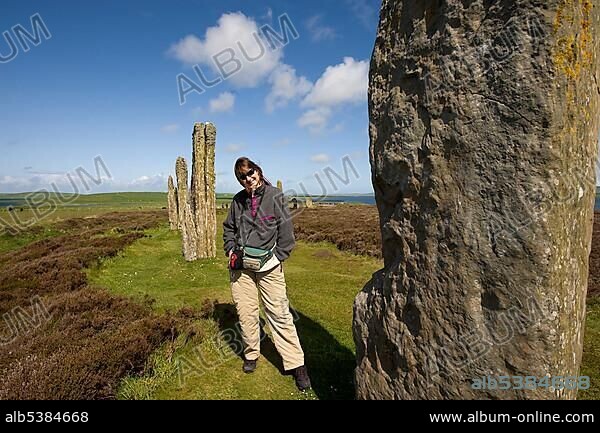 Tourist in the Neolithic ritual place, Ring of Brodgar, Stromness, Orkney Islands, Scotland, United Kingdom, Europe.