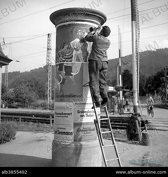 Advertising posters attached to advertising pillar ca. 1945,1955, Freiburg, Germany, Europe.