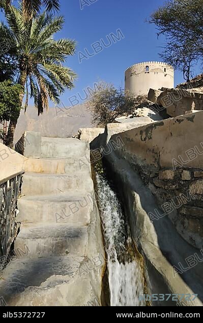 Traditional Falaj canal, irrigation system, Birkat al Mawz, UNESCO World Heritage Site, Hajar al Gharbi Mountains, Dhakiliya Region, Sultanate of Oman, Arabia, Middle East.