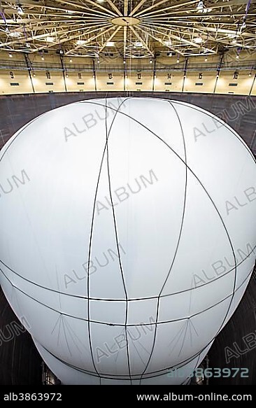 Installation by Christo, 90 meters high, 50 meters wide, consisting of 20,350 square meters of fabric and 4500 meters of rope, volume 177,000 cubic meters, "Big Air Package" exhibition of art projects by Christo, in the Oberhausen Gasometer, Oberhausen, North Rhine-Westphalia, Germany, Europe.