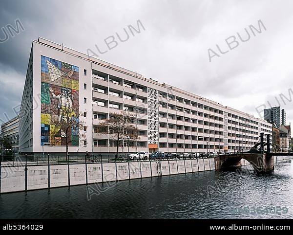 Renovated GDR panel building apartment house in Friedrichsgracht, with mural by Walter Womacka Man the measure of all things, Berlin-Mitte, Berlin, Germany, Europe.