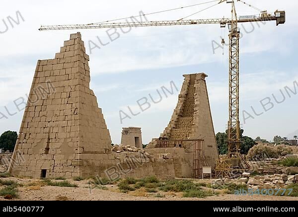 Reconstruction of the Tenth Pylon, building site with crane, Karnak Temple, Luxor, Egypt, Africa.