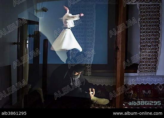 Statue of Mevlana under an holographic projection of a whirling dervish, Konya, Anatolia, Turkey, Asia.