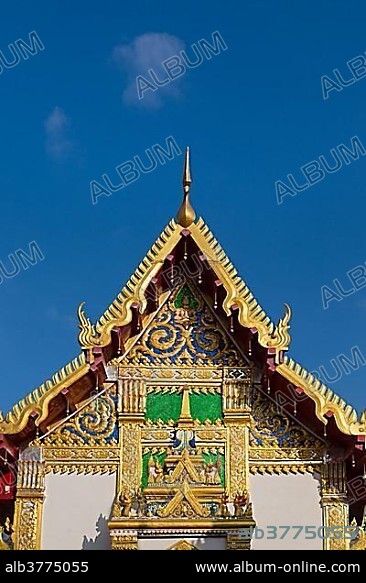 Pediment of the Bot in front of the Chedi of Wat Phra That Phanom, temple complex in Amphoe That Phanom, Nakhon Phanom Province, Isan, Thailand, Asia.