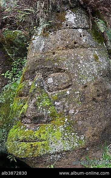 Sculpture of a face, hewn tuff rock, Isla Santa Maria or Floreana Island, Galapagos Islands, Ecuador, South America.