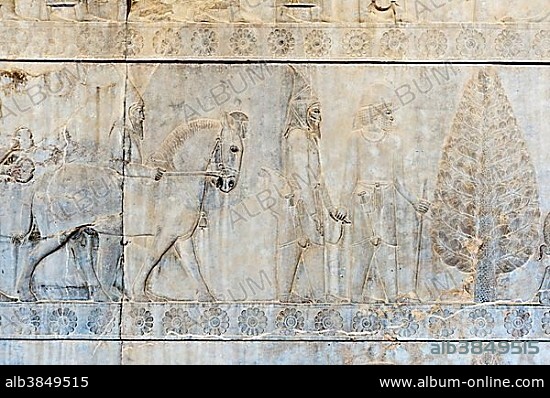 Ancient relief of the Achaemenids, Delegation of the Scythians with soldier of the Immortal Guard, Apadana Palace, ancient Persian city Persepolis, UNESCO World Heritage Site, Fars Province, Iran, Asia.