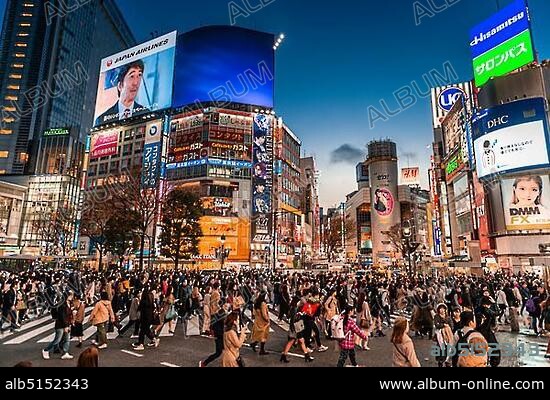 Shibuya Crossing, crowds of people at crossing colorful signs, illuminated advertising at dusk, railway station Shibuya, Shibuya, Udagawacho, Tokyo, Japan, Asia.