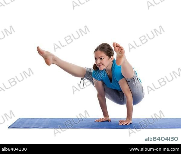 Yoga, young beautiful woman yoga instructor doing Firefly asana pose (Titibasana) exercise isolated on white background.