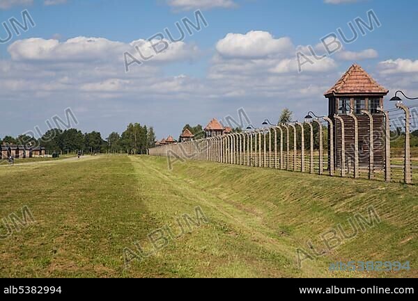 Barb wire electric fence surrounding the Auschwitz II-Birkenau former Nazi Concentration Camp, Auschwitz-Birkenau, Poland, Europe.