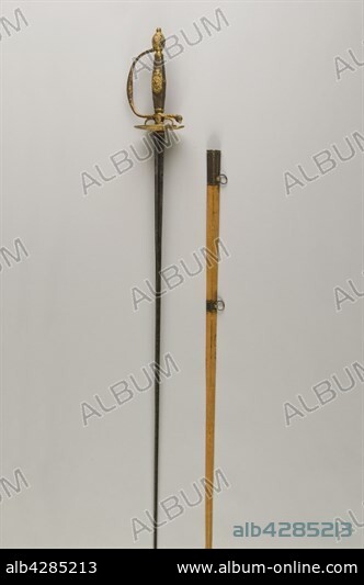 Epée d'officier ou épée de cour. Epoque Louis XVI. Monture en argent en partie dorée. Décor d'attributs militaires et scientifiques.. Lame triangulaire gravée au tiers, marquée "De la Manufacture de la marque au raisin Solingen".. Fourreau recouvert de lézard.. Private collection.