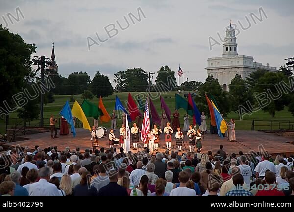 The pledge of allegiance to the American flag, beginning of the Nauvoo Pageant, staged every summer by the Mormon church, traces the history of the Mormons who lived in Nauvoo in the 1840s, the rebuilt Nauvoo Temple at back, Nauvoo, Illinois, USA, North America.