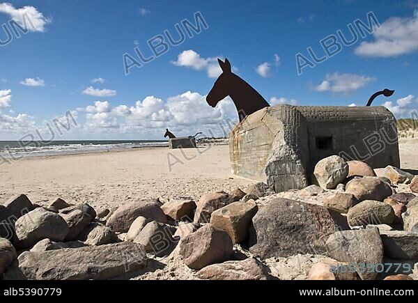 Art on an old German bunker from World War II, with machinegun bullet holes on the beach of Blavand, West Jutland, Denmark, Europe.