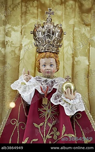 Baby Jesus with crown and orb, children's doll in a Sicilian Baroque church, Palermo, Sicily, Italy, Europe.