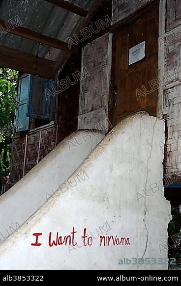 Graffiti from a monk on the wall of a staircase, I want to nirvana, in the Buddhist Monastery Wat Nakhoun Noi, Vientiane province, Laos, Asia.