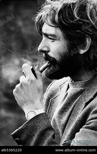 Young man smoking a pipe, East Germany, around 1984.