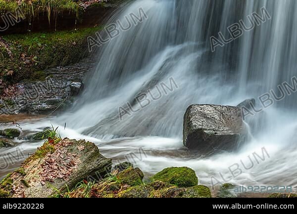 Fresh water waterfall on rocks moss cover in mountain. Fresh water waterfall on rocks moss cover in mountain.osges Alsace, France, Europe.