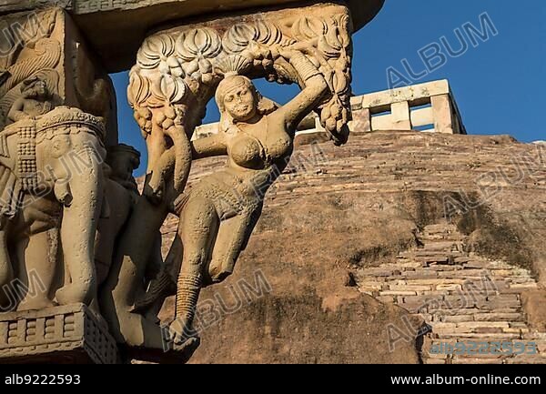 Yakshini (Yakshi) of the East Torana, gateway to the Great Stupa, Stupa 1, at Sanchi, some trees. The main monument in the group of Buddhist Monuments at Sanchi. UNESCO World Heritage Site. Sanchi, Madhya Pradesh, India, Asia.