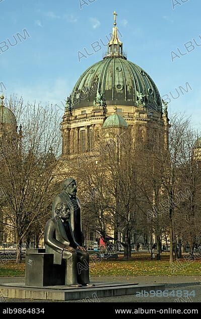 The Marx-Engels-Forum is a monument complex built in the 1980s in Berlin-Mitte. It is located between Spandauer Straße and the Spree River, close to Berlin's city hall, the ?Red City Hall? Since the 1980s, the bronze sculptures of Karl Marx and Friedrich Engels had stood at the Red Town Hall. Now they have to make way for the construction site for the underground railway. The old centre of Berlin is changing its face once again. The statues of Karl Marx (foreground) and Friedrich Engels at Marx-Engels-Forum. In the back