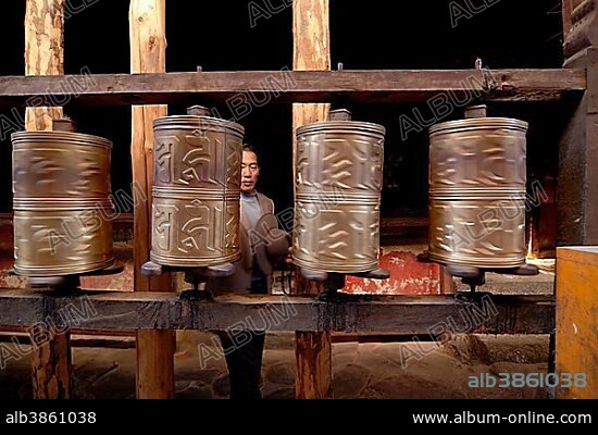 Prayer wheels and Tibetan pilgrims in Lhasa, Jokhang Temple, Lhasa, Tibet, China, Asia.