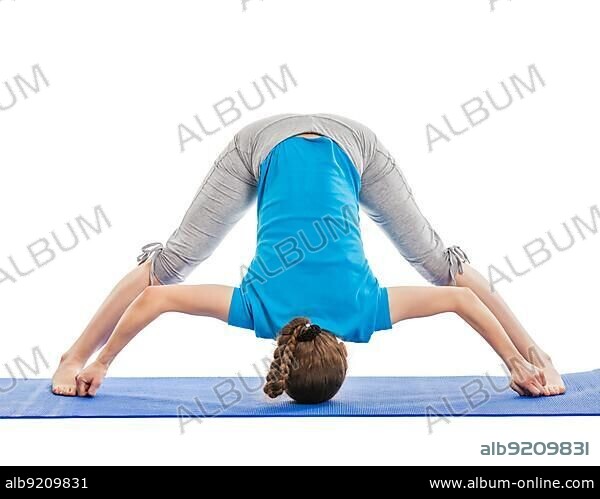 Yoga, young beautiful slender woman yoga instructor doing Wide Legged standing Forward Bend D (Prasarita Padottanasana D) asana exercise isolated on white background.