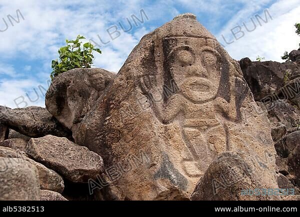 Faces carved into rocks, La Chaquira, above the Rio Magdalena, San Agustin, Huila, Colombia, South America.