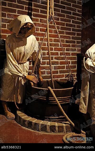Medieval salt production, re-enacted with dummies, German Salt Museum, Lueneburg, Lower Saxony, Germany, Europe.
