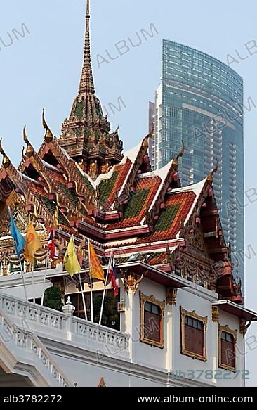 Temple roof, in the back modern skyscraper, Wat Yannawa, Buddhist temple complex, business district Sathon, Bangkok, Thailand, Asia.