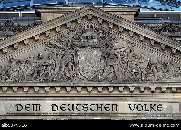 Lettering reading Dem Deutschen Volke, For the German Nation and relief in a tympanum above the main entrance to the Reichstag Building, Berlin, Germany, Europe.