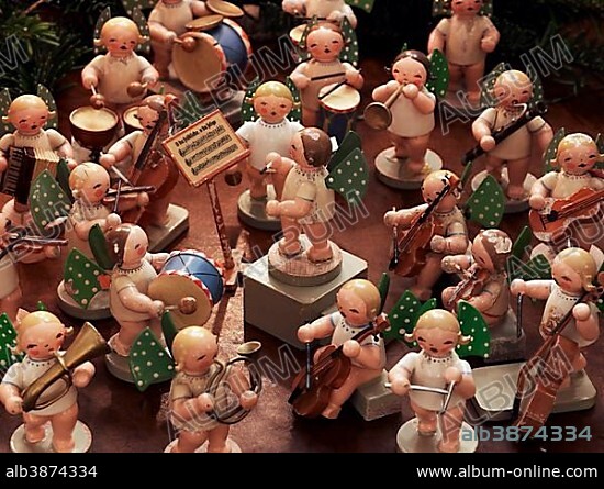 Handmade wooden angels playing musical instruments as a table decoration from the Erzgebirge or Ore Mountains, Germany, Europe.